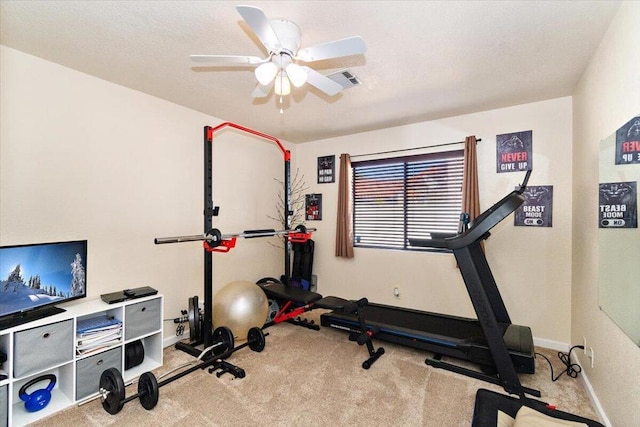 exercise area with light carpet and ceiling fan