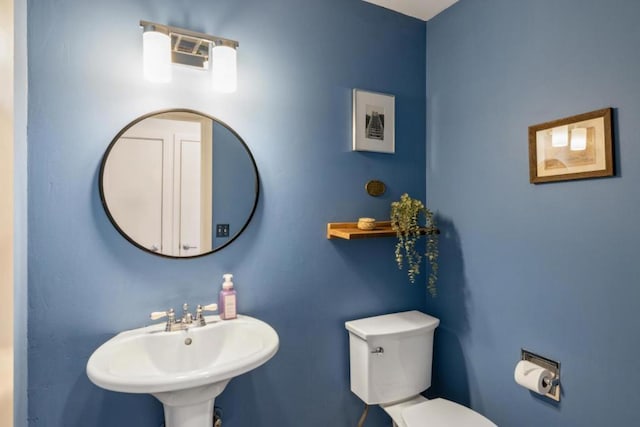 bathroom with sink and toilet