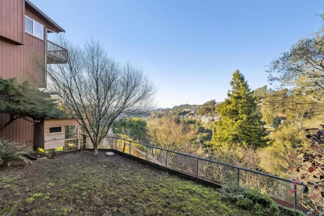 view of yard with a balcony