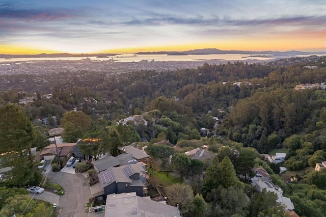 aerial view at dusk with a water view