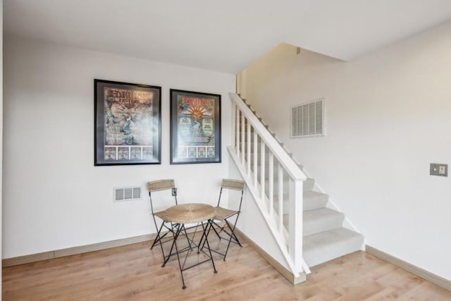 stairway featuring hardwood / wood-style flooring