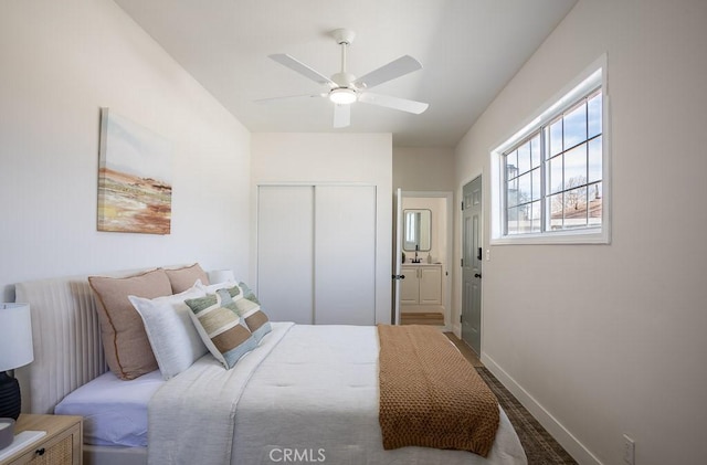 bedroom featuring ceiling fan and a closet