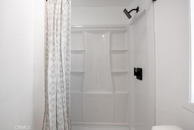 bathroom featuring walk in shower