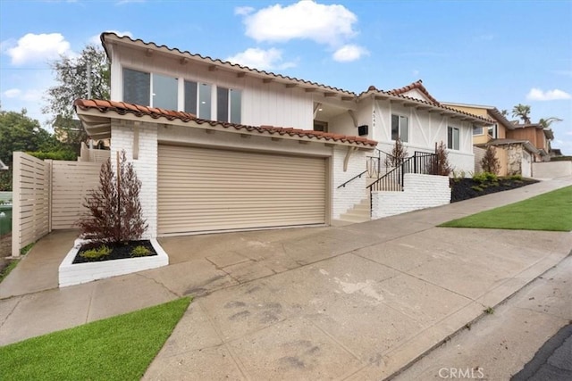 mediterranean / spanish house featuring a garage