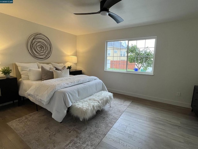 bedroom featuring wood-type flooring and ceiling fan