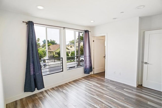 spare room with light wood-type flooring