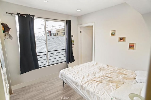 bedroom with light wood-type flooring