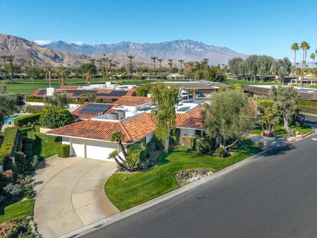 birds eye view of property featuring a mountain view