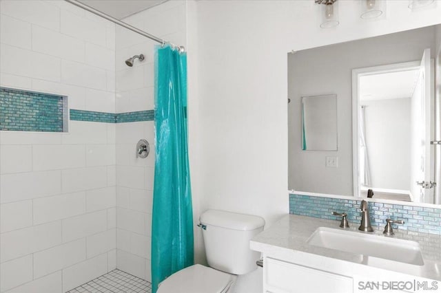 bathroom featuring vanity, decorative backsplash, curtained shower, and toilet