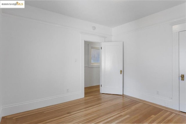 unfurnished room featuring light wood-type flooring