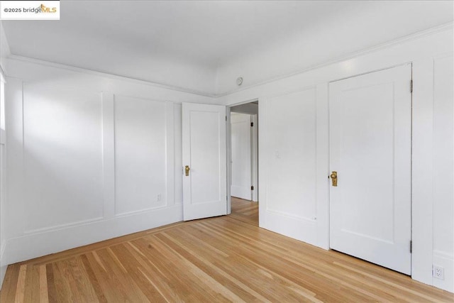 unfurnished bedroom with light hardwood / wood-style floors