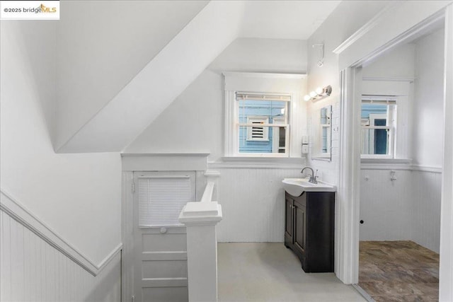 bathroom with a healthy amount of sunlight and vanity