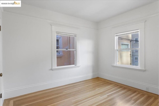 empty room featuring wood-type flooring