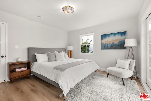 bedroom with light wood-type flooring