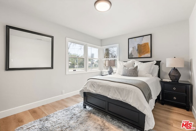 bedroom with light hardwood / wood-style floors