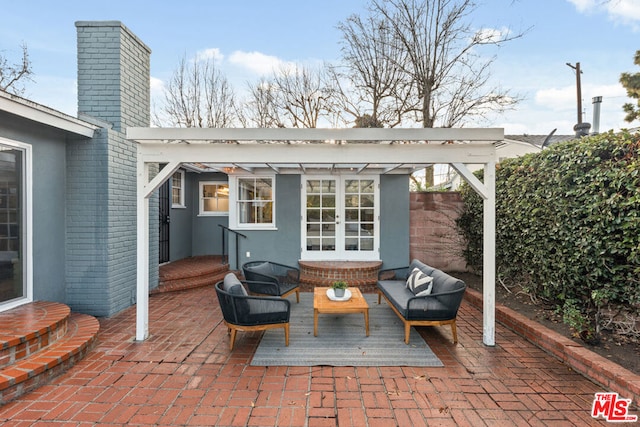 view of patio / terrace with an outdoor hangout area and a pergola