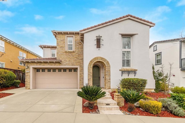 mediterranean / spanish-style home featuring a garage