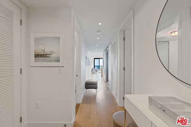 corridor featuring light hardwood / wood-style floors