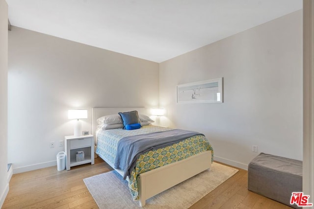 bedroom featuring hardwood / wood-style flooring