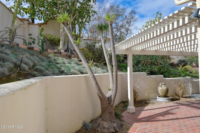 view of patio featuring a pergola