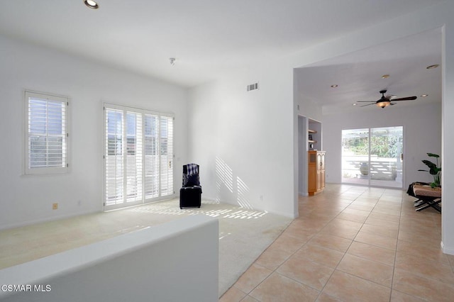 interior space with ceiling fan and a healthy amount of sunlight