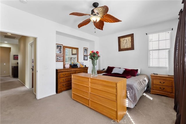 carpeted bedroom featuring ceiling fan