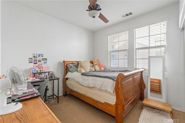 bedroom featuring ceiling fan and light colored carpet