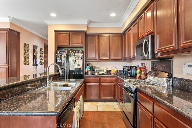 kitchen featuring sink, dark stone counters, black appliances, crown molding, and light hardwood / wood-style flooring