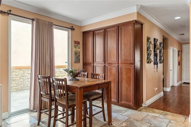 tiled dining area with crown molding