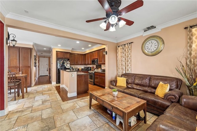 living room with ornamental molding and ceiling fan