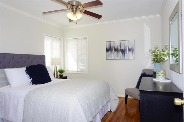 bedroom with crown molding, ceiling fan, and dark hardwood / wood-style floors