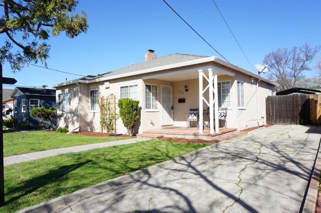 bungalow-style house featuring a front yard