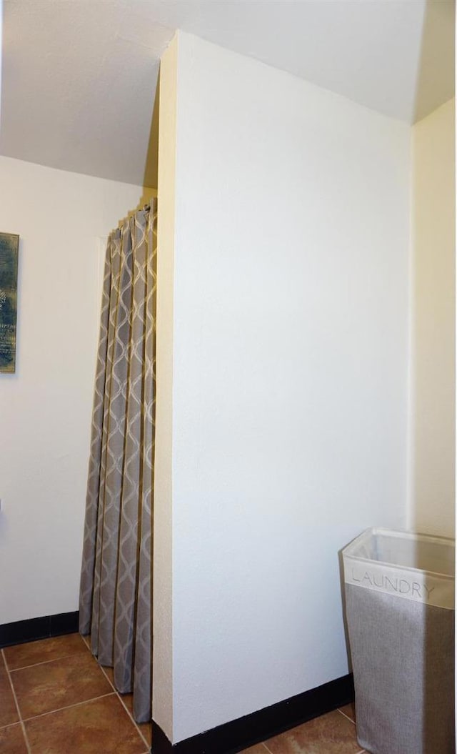 bathroom featuring tile patterned flooring and walk in shower