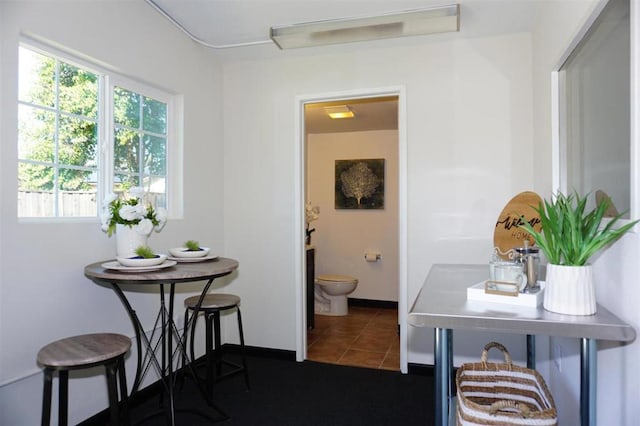 interior space featuring dark tile patterned floors