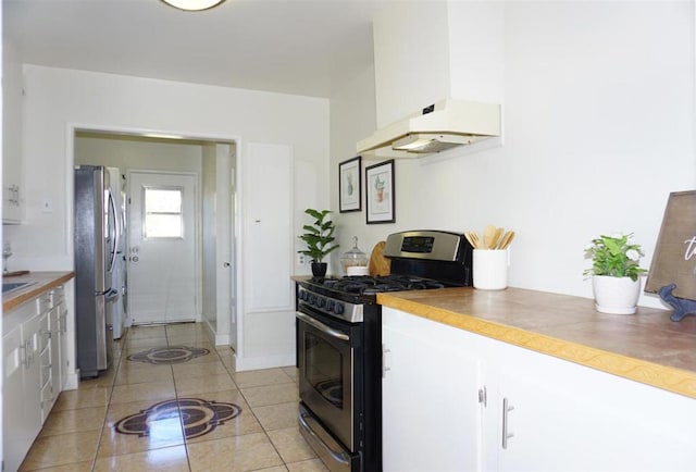 kitchen featuring white cabinetry, appliances with stainless steel finishes, and light tile patterned floors