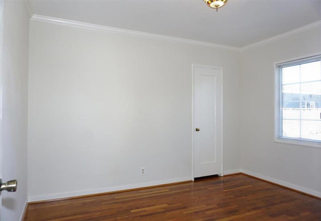 unfurnished room featuring crown molding and dark hardwood / wood-style floors