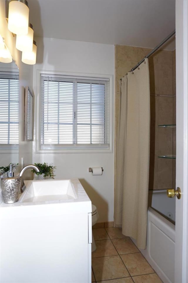 full bathroom featuring tile patterned flooring, vanity, shower / tub combo with curtain, and toilet