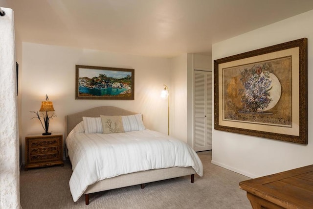 carpeted bedroom featuring a closet