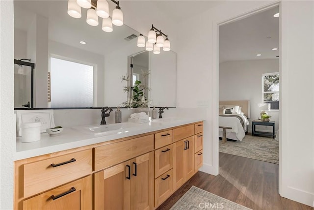 bathroom featuring vanity and hardwood / wood-style flooring