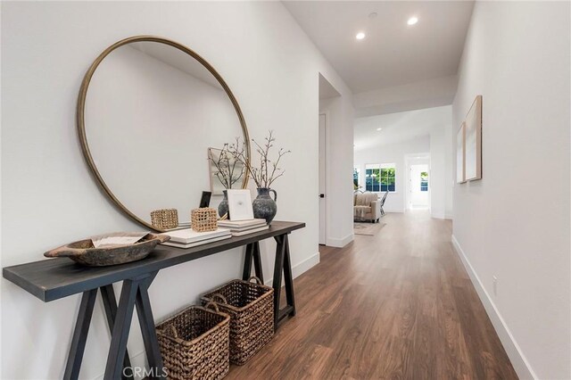 hallway featuring dark hardwood / wood-style flooring