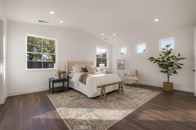 bedroom with lofted ceiling and dark hardwood / wood-style flooring