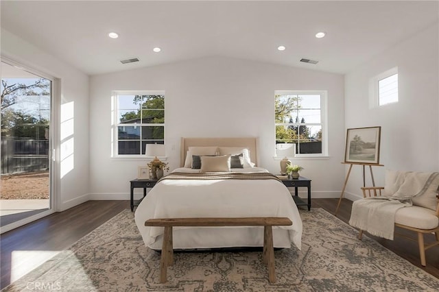 bedroom featuring dark hardwood / wood-style floors, vaulted ceiling, and access to outside