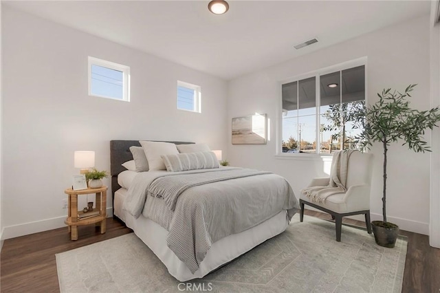 bedroom with hardwood / wood-style floors