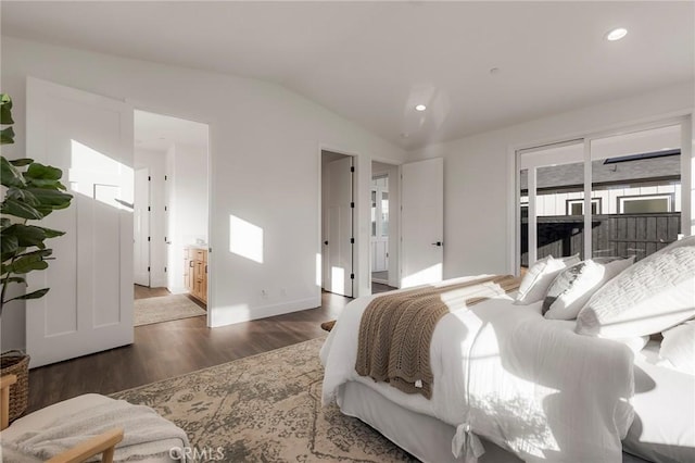 bedroom with dark hardwood / wood-style floors and vaulted ceiling