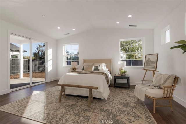 bedroom featuring dark hardwood / wood-style flooring, access to exterior, and vaulted ceiling