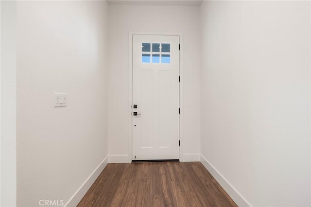 doorway with dark hardwood / wood-style flooring