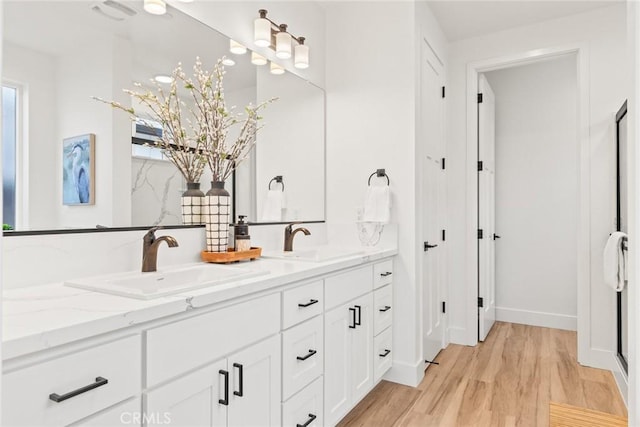 9 Harkness Ct, Chico, CA 95973 - bathroom with double vanity and wood finished floors