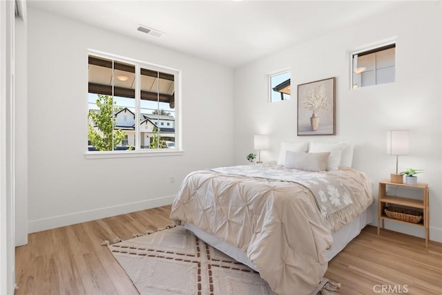 9 Harkness Ct, Chico, CA 95973 - bedroom featuring baseboards and wood finished floors