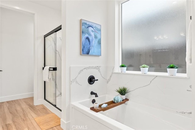 9 Harkness Ct, Chico, CA 95973 - full bathroom featuring a garden tub, a shower stall, plenty of natural light, and wood finished floors