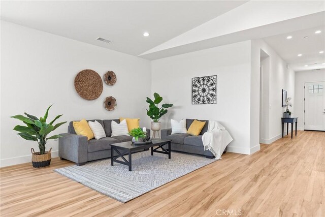 9 Harkness Ct, Chico, CA 95973 - living room featuring wood finished floors, recessed lighting, and lofted ceiling